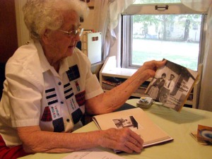 Gail Martin shows copies of her new book, My Flint Hills Childhood (photo courtesy of The El Dorado Times newspaper)